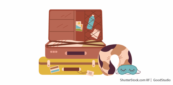 Zwei Reisekoffer, eine Nackenrolle zum schlafen und eine Schlafmaske für die Reise